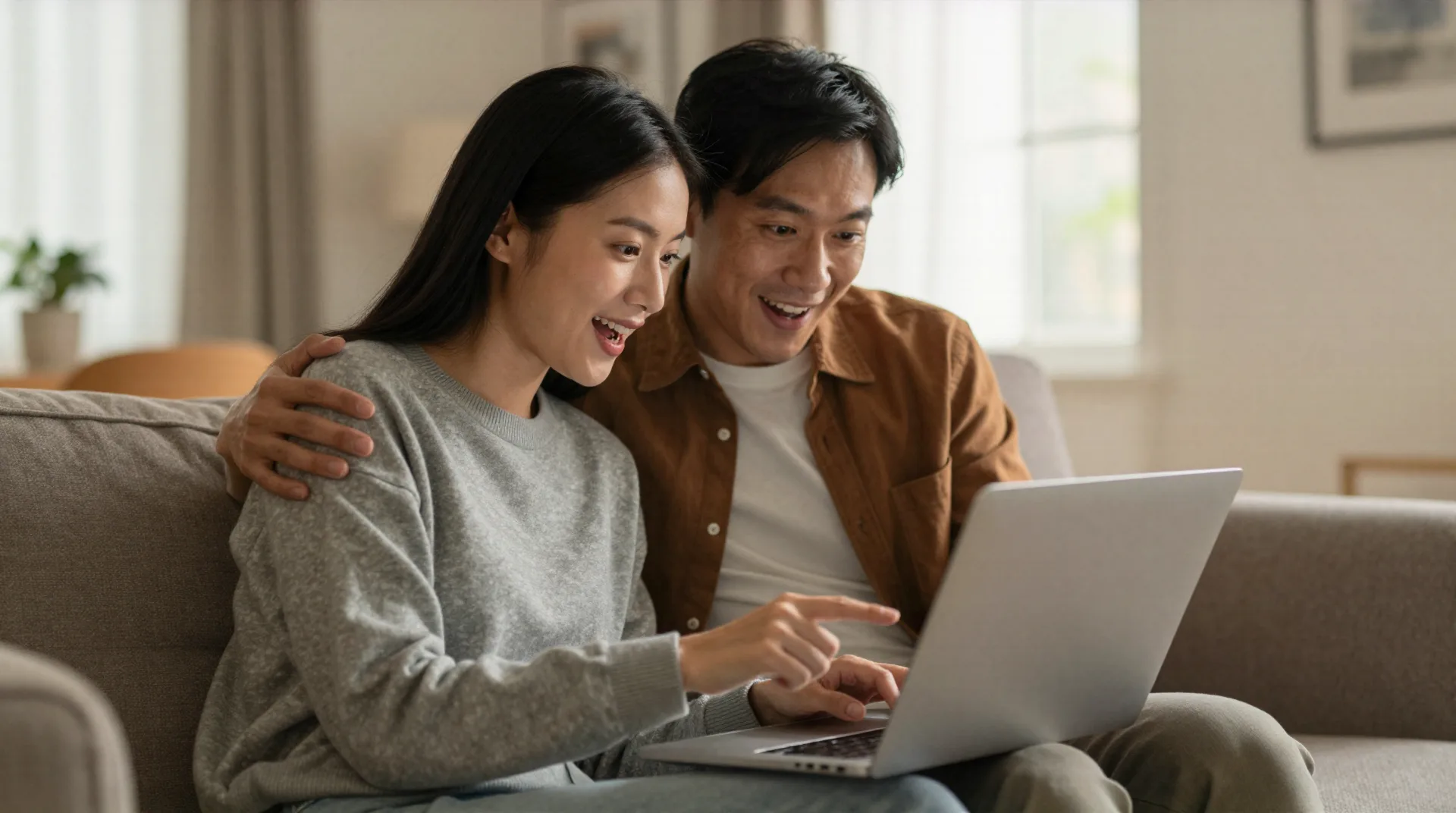 Couple browsing AI gift advisor on laptop in cozy living room
